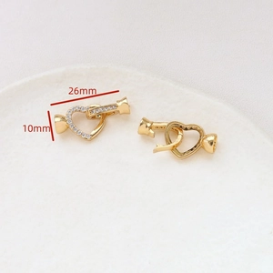 Detailed view of 26mm gold-plated heart clasp with cubic zirconia for DIY jewelry