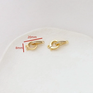 Macro shot showing 20mm gold plated spring clasp with zircon inlay for jewelry DIY