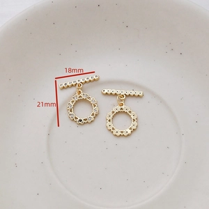 Close-up of gold-plated heart-shaped OT toggle clasp set with cubic zirconia for jewelry