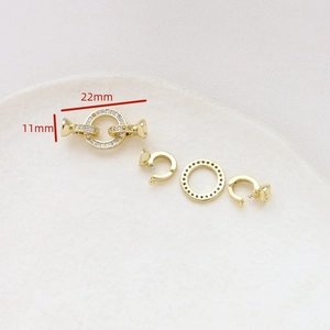 Macro shot of 22mm gold plated jewelry connector clasp with cubic zirconia inlay details