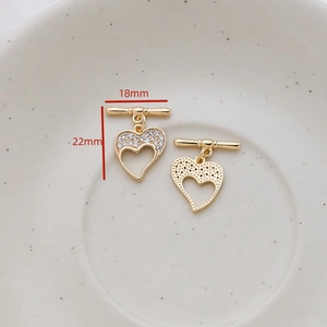 Macro detail of gold plated heart toggle clasp with micro zircon stones for DIY jewelry