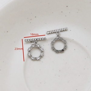 Detailed view of silver heart-shaped toggle clasp with sparkling crystals for jewelry
