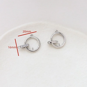 Detailed view of silver-plated DIY connectors with zirconia inlay and 20mm diameter size