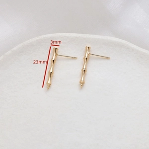 Detailed view of 23mm gold-plated bamboo-shaped earrings for DIY jewelry making