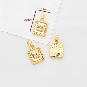 Macro shot of 21x12mm gold butterfly charms with mother of pearl inlay and dimensions