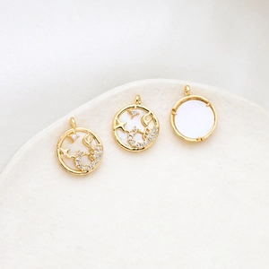 Detail of Scorpio zodiac pendant in gold-plated brass with white mother of pearl inlay