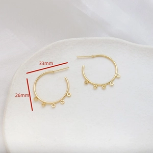 Detail of 33mm gold-plated C-shape earring hoops with five loops for DIY jewelry making