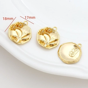 Macro detail of 18mm gold-plated floral octagonal pendants for DIY jewelry making