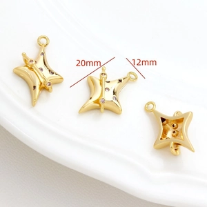 Detailed macro view of 20mm gold star pendants with pink zircon for DIY jewelry making