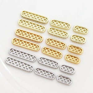 Macro detail of geometric hollow jewelry connectors with sparkling cubic zirconia inlay