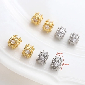 Détail de perles d'espacement plaquées or 18k et argent avec cristaux, taille 6x8mm