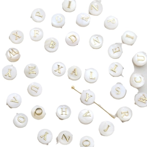 DIY shell-like round alphabet beads with gold letters for custom jewelry making