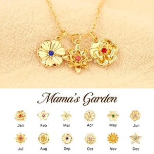 Detalle de collares de flores de nacimiento en oro con piedras preciosas de colores