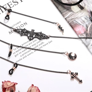 4pcs set of gothic black alloy chains with cross, lightning, and moon pendants