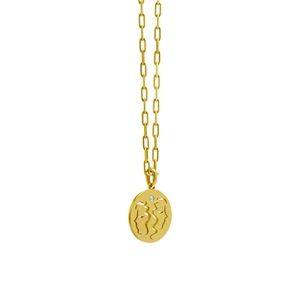 Macro shot of gold paperclip chain and hollow circular Gemini pendant with diamond