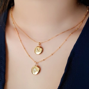 Διπλό κολιέ με επίστρωση χρυσού 18K με μενταγιόν φεγγάρι αστέρι ήλιο και ζιργκόν