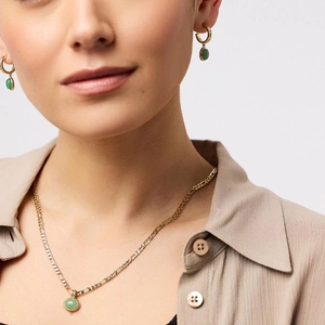Close-up of Figaro chain necklace and earrings with oval green aventurine stones