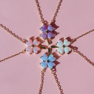 Lucky four-leaf clover necklaces with iridescent opal pendants in gold plating