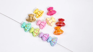 Detail of acrylic princess dress beads with star moon patterns for DIY jewelry crafts