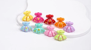 Detail of colorful acrylic princess dress beads with gold star patterns for DIY crafting