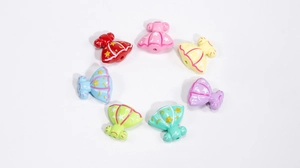 Macro shot of colorful resin princess dress beads with star textures for DIY jewelry crafts