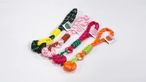 Detailed close-up of colorful paracord braided keychains with round monkey fist knots