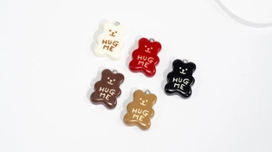 Colorful resin bear pendants with HUG ME text and metal rings for DIY jewelry projects