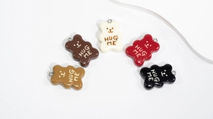 Detailed view of colorful 3D resin bear charms with metal hooks for DIY accessories