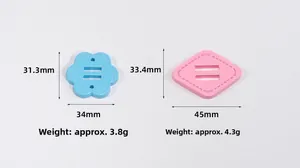 Detailed view of blue flower and pink diamond silicone strap adjustment beads for DIY crafts