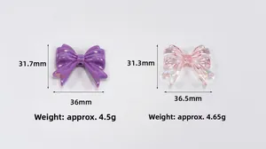 Macro shot showing purple pearlized and pink iridescent acrylic bow beads with dimensions