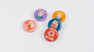 Macro detail of colorful cartoon dog acrylic beads for DIY jewelry and phone chains