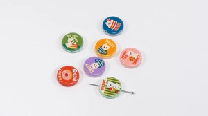 Detail of colorful double-sided cartoon cat and dessert beads for DIY jewelry making
