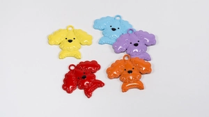 Set of five colorful poodle charms in yellow, blue, purple, red, and orange for keychains