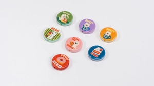 Detailed view of colorful round cartoon dog beads for DIY jewelry and phone chains