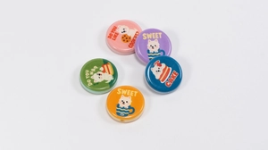 Detail of five colorful round cartoon dog charms for DIY phone chains and accessories