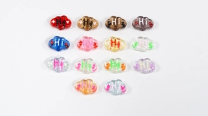 Macro detail of cloud-shaped acrylic beads with Hi text for DIY jewelry making