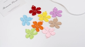 Close-up of colorful five-petal flower alloy charms for DIY keychains and jewelry