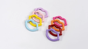 Detailed view of colorful lip-shaped metal spring hooks for DIY keychain accessories
