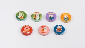 Close-up of colorful cartoon puppy printed round beads for DIY jewelry and phone chains