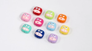 Perline colorate in acrilico a forma di mostro con espressioni buffe per creazioni DIY
