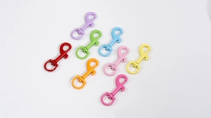 Close-up of swivel spring snap hooks in eight vibrant candy colors for keychains and bags