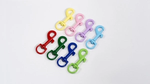 Macro view of colorful spring snap hooks with swivel rings in eight vibrant paint finishes