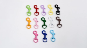 Detailed close-up of colorful paint-coated zinc alloy swivel hooks for bags and keychains