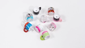 Close-up of assorted colorful acrylic mini cup beads for DIY jewelry and keychain charms