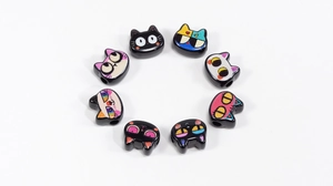 Detail view of 8 cute cat-shaped acrylic beads with colorful Japanese cartoon expressions