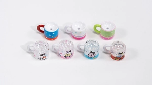 Detailed view of colorful cartoon cat and star charms for DIY beaded jewelry accessories