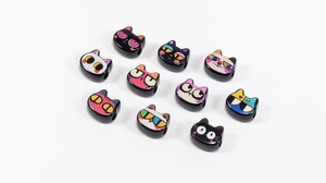 Close-up of colorful acrylic cat-shaped beads for DIY jewelry and phone charms