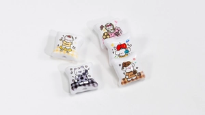 Close-up of acrylic cat pillow beads for DIY jewelry with cute cartoon illustrations