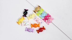 Close-up of colorful acrylic candy beads with polka dots for DIY jewelry making