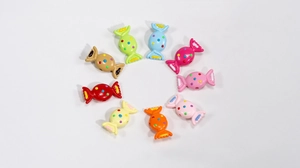 Colorful candy-shaped acrylic beads for DIY jewelry and hair accessories on white background